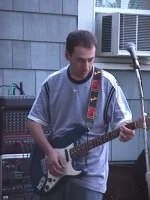 doganwithguitarinct.webp