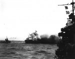 A_heavy_explosion_on_board_USS_Lexington_(CV-2)_blows_an_aircraft_over_her_side,_8_May_1942_(8...jpg